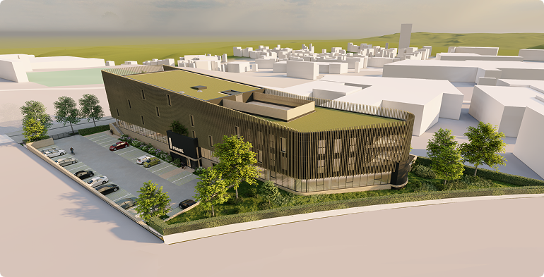 Vue aérienne du programme tertiaire PÉGASE développé par BMG Foncière à Laxou, immeuble de bureaux avec stationnements et espaces végétalisés.